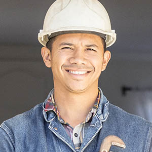 Handyman smiling with tools